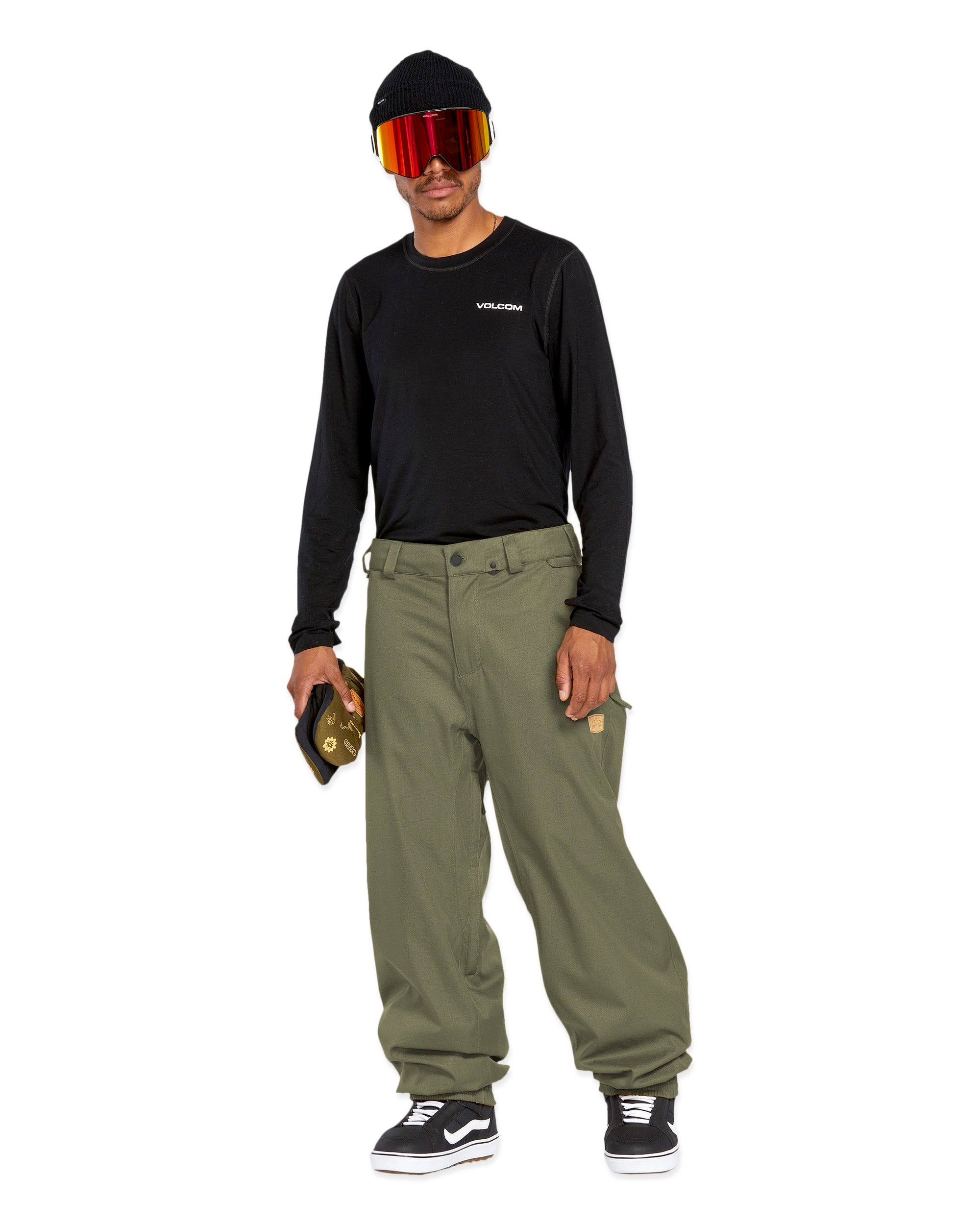 Volcom Men's Arthur 20K Shell Pant - A black snow pant with a zippered pocket on the thigh and adjustable Velcro straps at the waist.