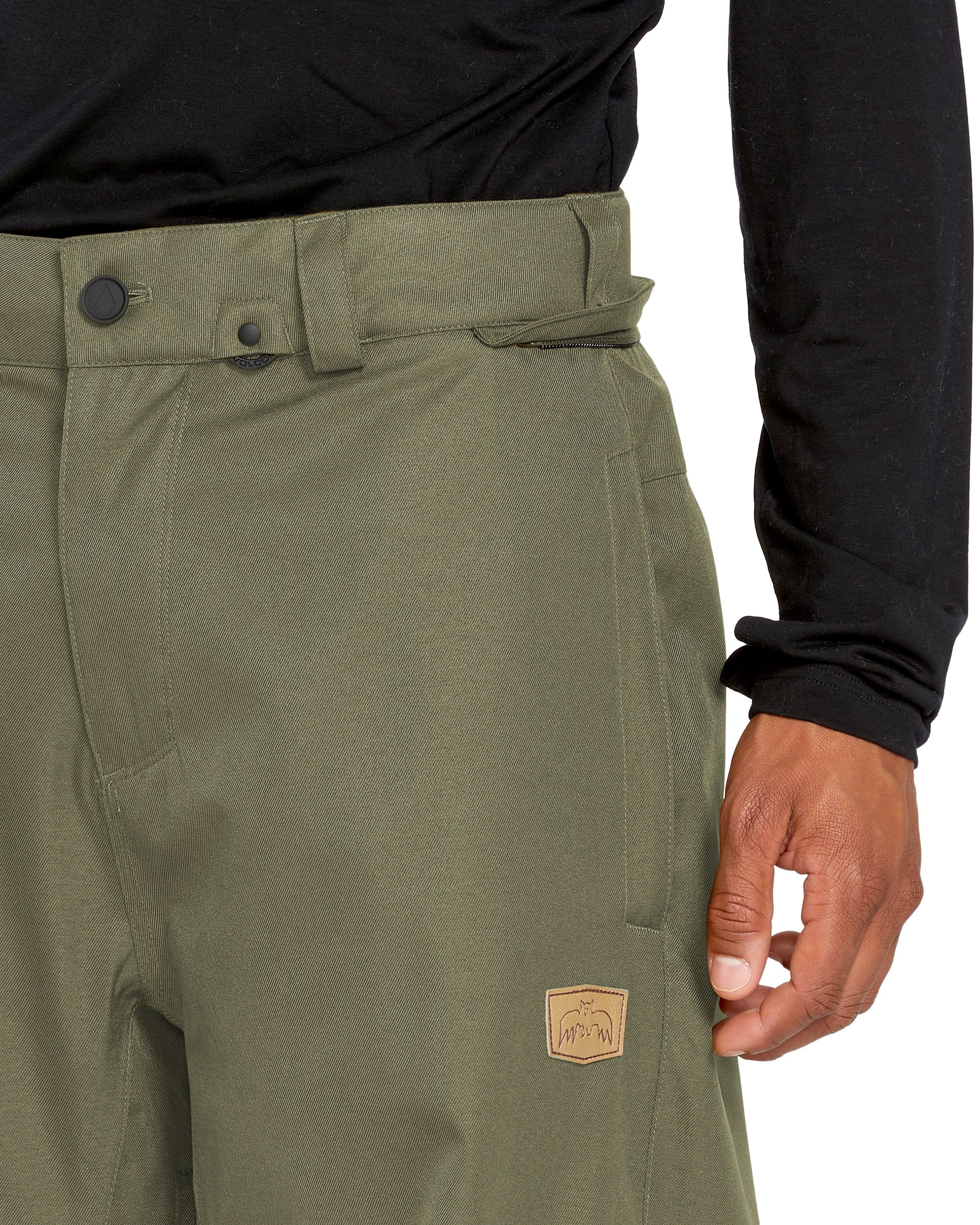 Volcom Men's Arthur 20K Shell Pant - A pair of olive green pants with a belt loop and button fly closure.