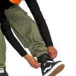Volcom Men's Arthur 20K Shell Pant - A pair of olive green snow pants with a zippered pocket on the side and adjustable Velcro straps at the ankles.