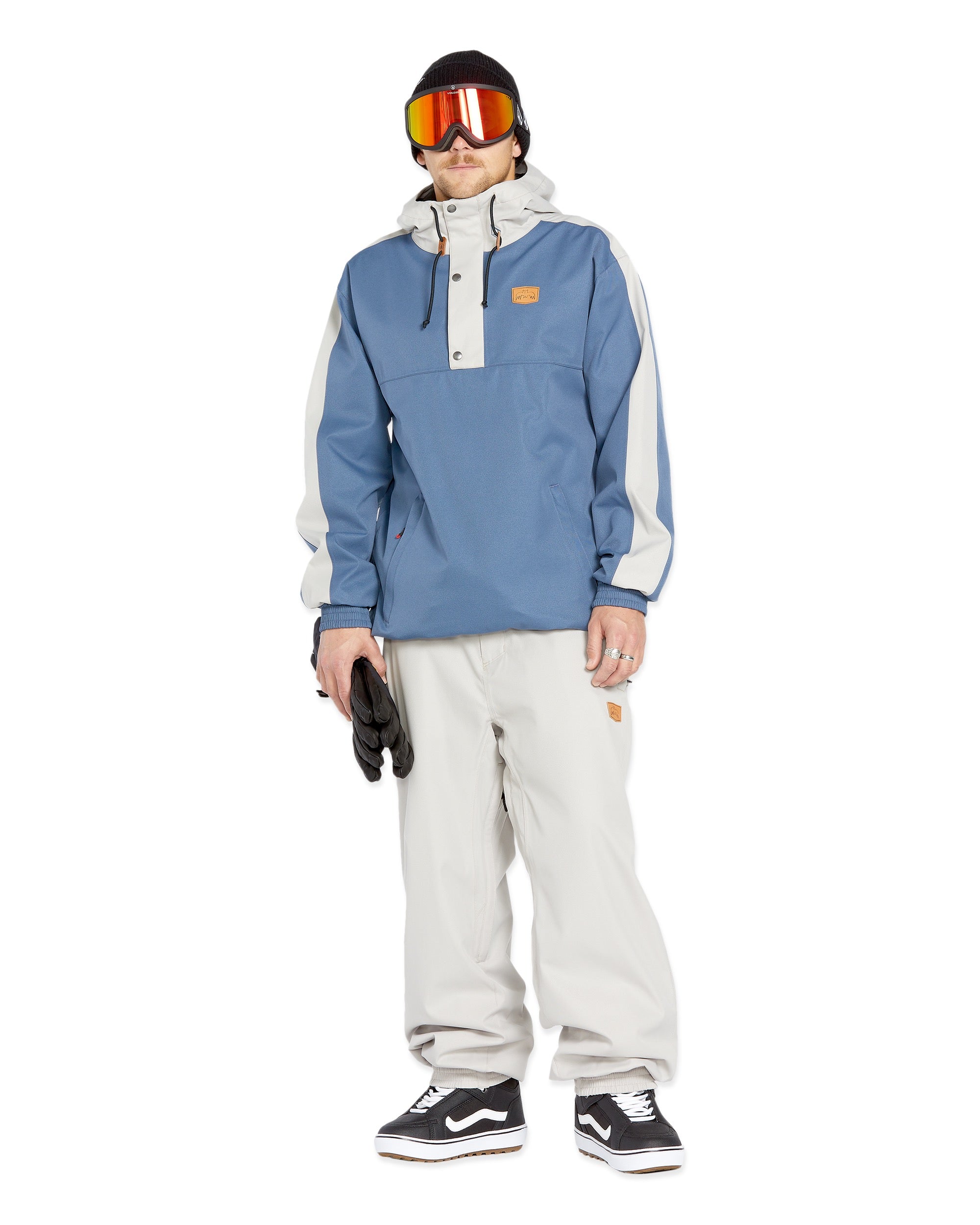 Volcom Men's Arthur 20K Shell Pant - A blue and white snow pant with a snap-button closure at the waist, featuring an adjustable cuff on one leg.