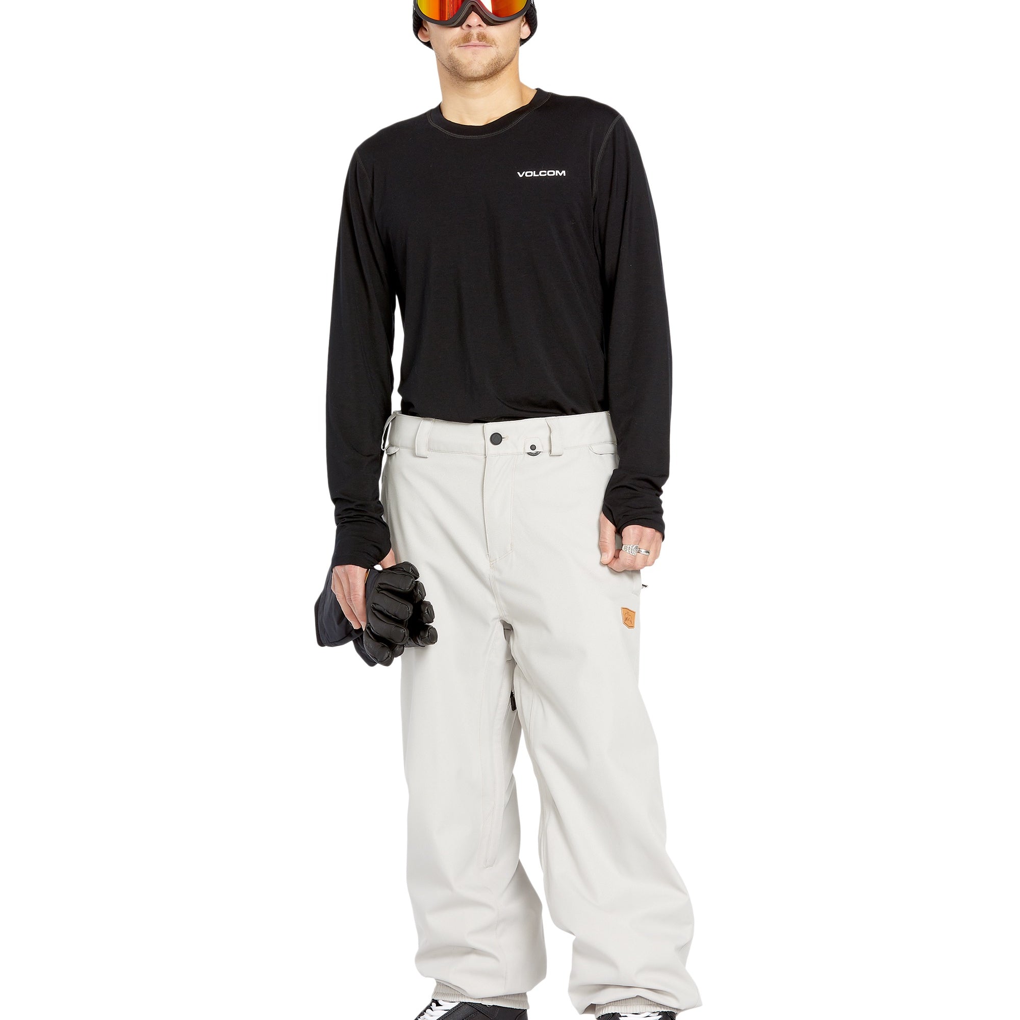 Volcom Men's Arthur 20K Shell Pant - A black snow pant with a zippered pocket on the thigh and adjustable Velcro straps at the waist.