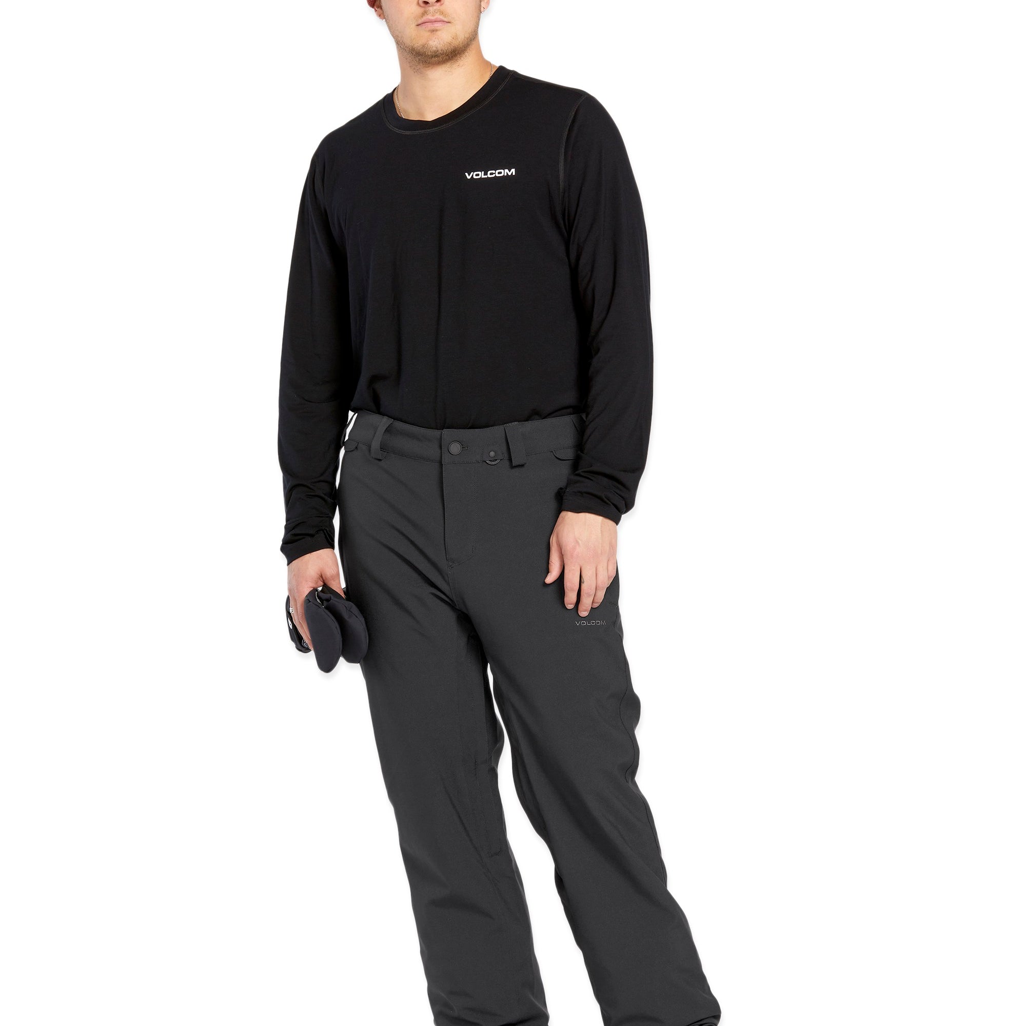Volcom Men's Freakin' Snow Chino Pant - A pair of black snow pants with a subtle white stripe on the side seam.