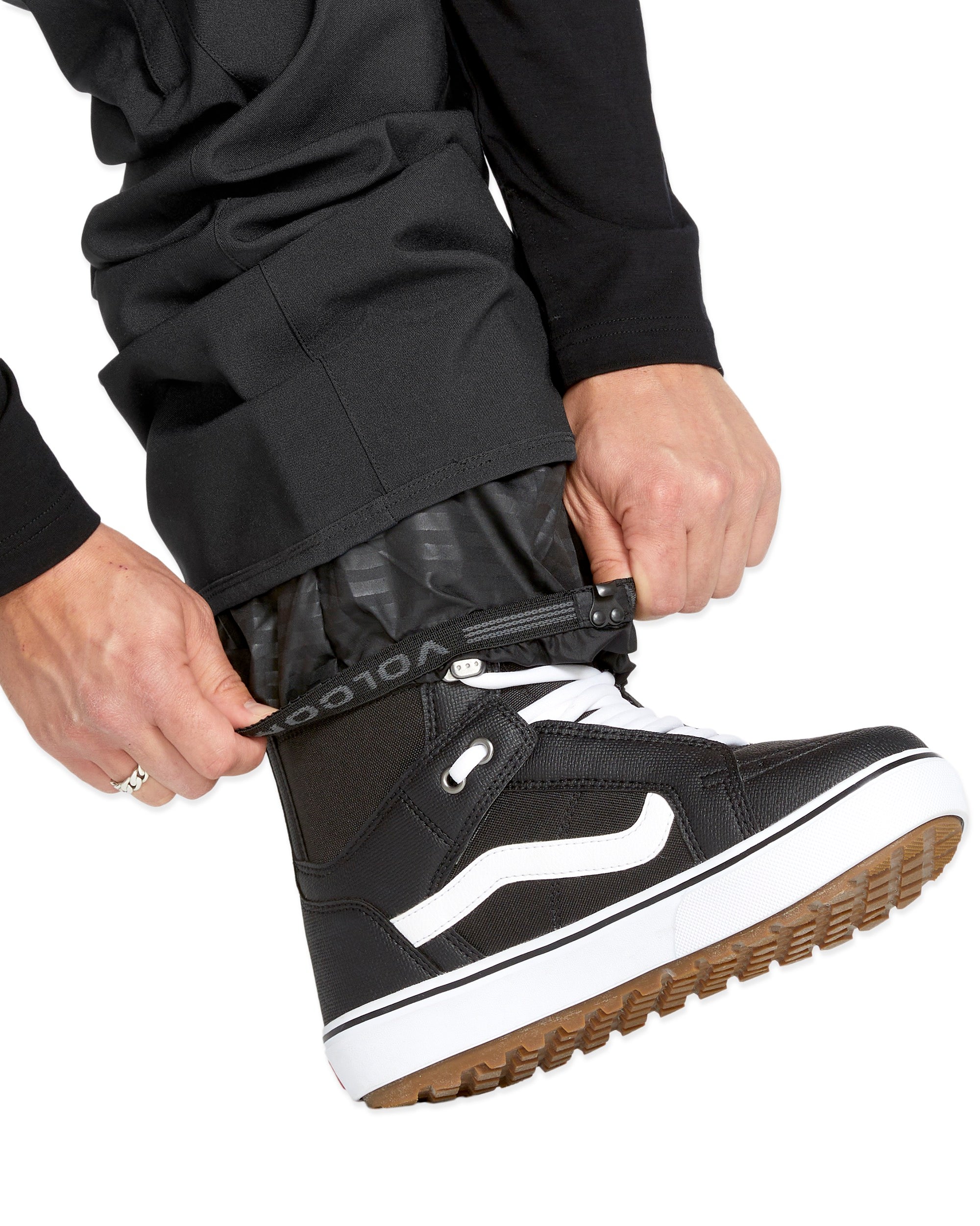 Volcom Men's Freakin' Snow Chino Pant - Black snow pants with a subtle white pattern on the side of the leg.