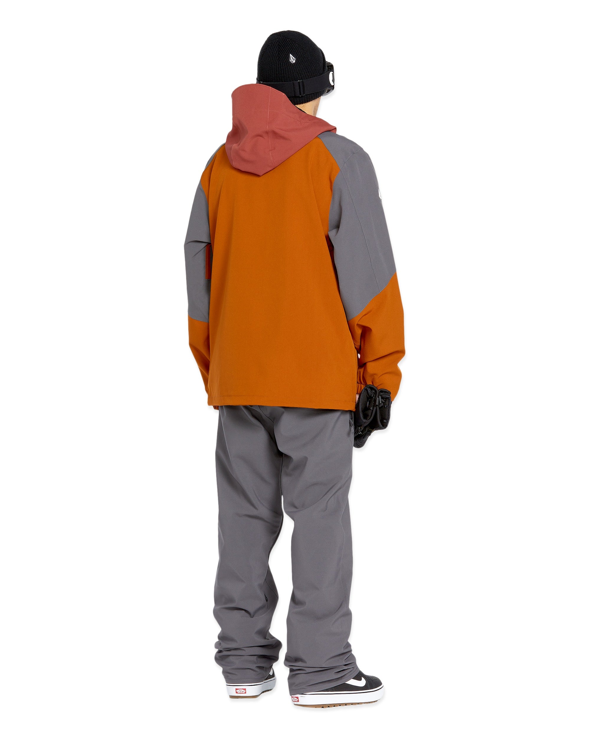 Volcom Men's Freakin' Snow Chino Pant 2025 - A pair of dark-washed, straight-leg chinos with a subtle snowboarder graphic on the left leg.