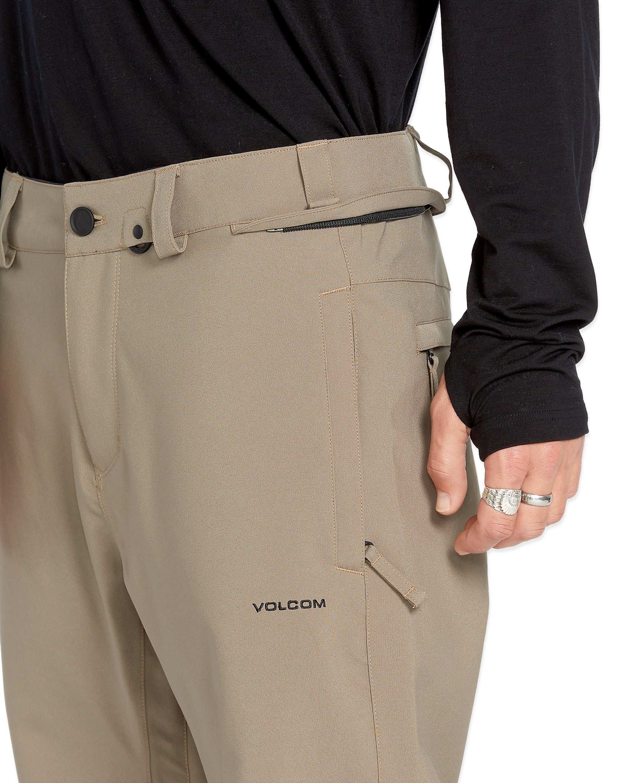 Volcom Men's Freakin' Snow Chino Pant 2025 - Khaki pants with a zippered pocket on the right thigh and belt loops.
