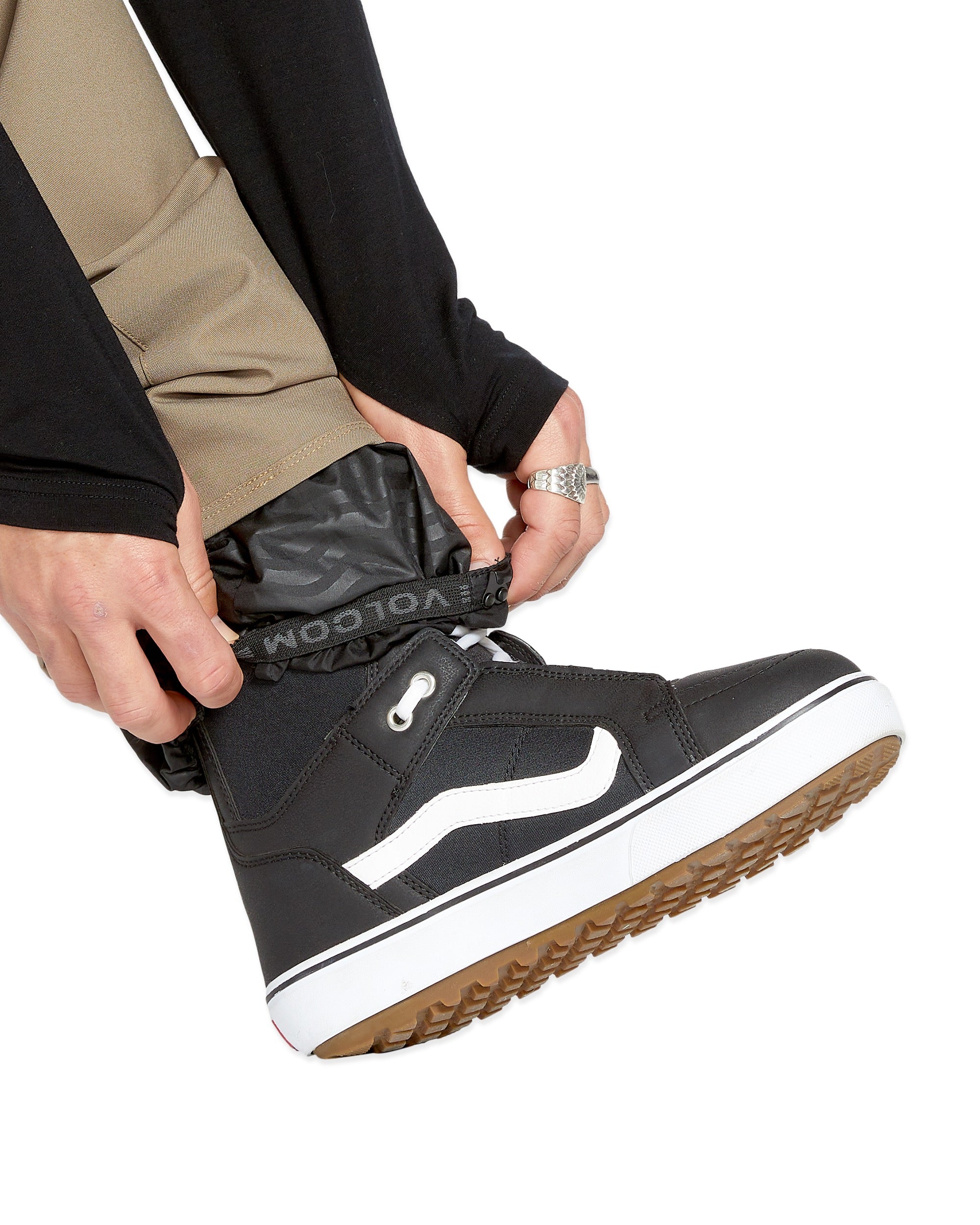 Volcom Men's Freakin' Snow Chino Pant - Black snow pants with a subtle camouflage pattern on the side of one leg.