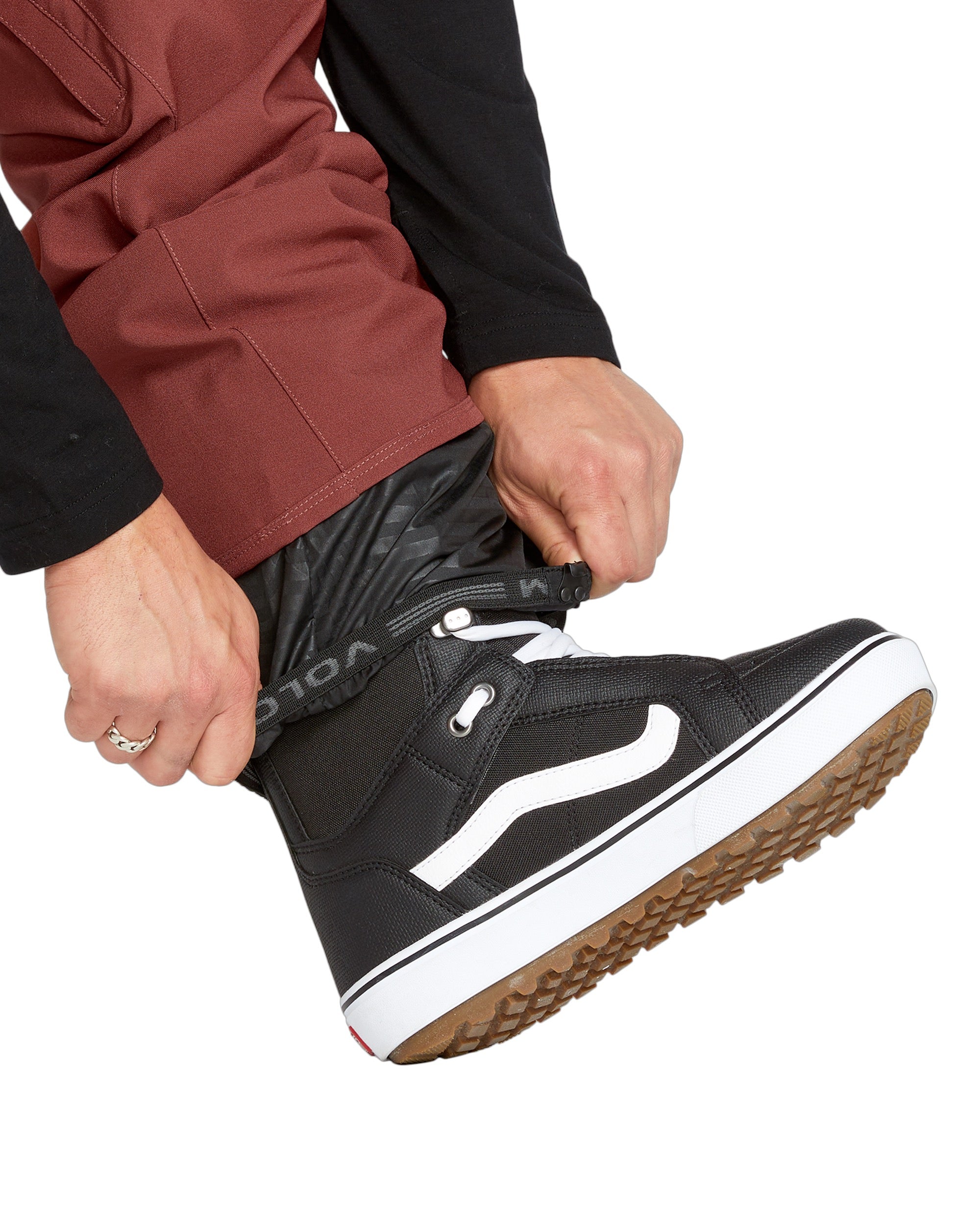 Volcom Men's Freakin' Snow Chino Pant - Black snow pants with a subtle white pattern on the side of the leg.