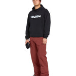 Volcom Men's Freakin' Snow Chino Pant 2025 - A pair of brown snow pants with a zippered pocket on the side and a logo patch on the left thigh.