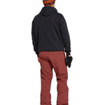 Volcom Men's Freakin' Snow Chino Pant - A pair of brown snow pants with a zippered pocket on the side.