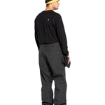 Volcom Men's 5 Pocket Shell Pant - Black pants with white logo on left thigh pocket.