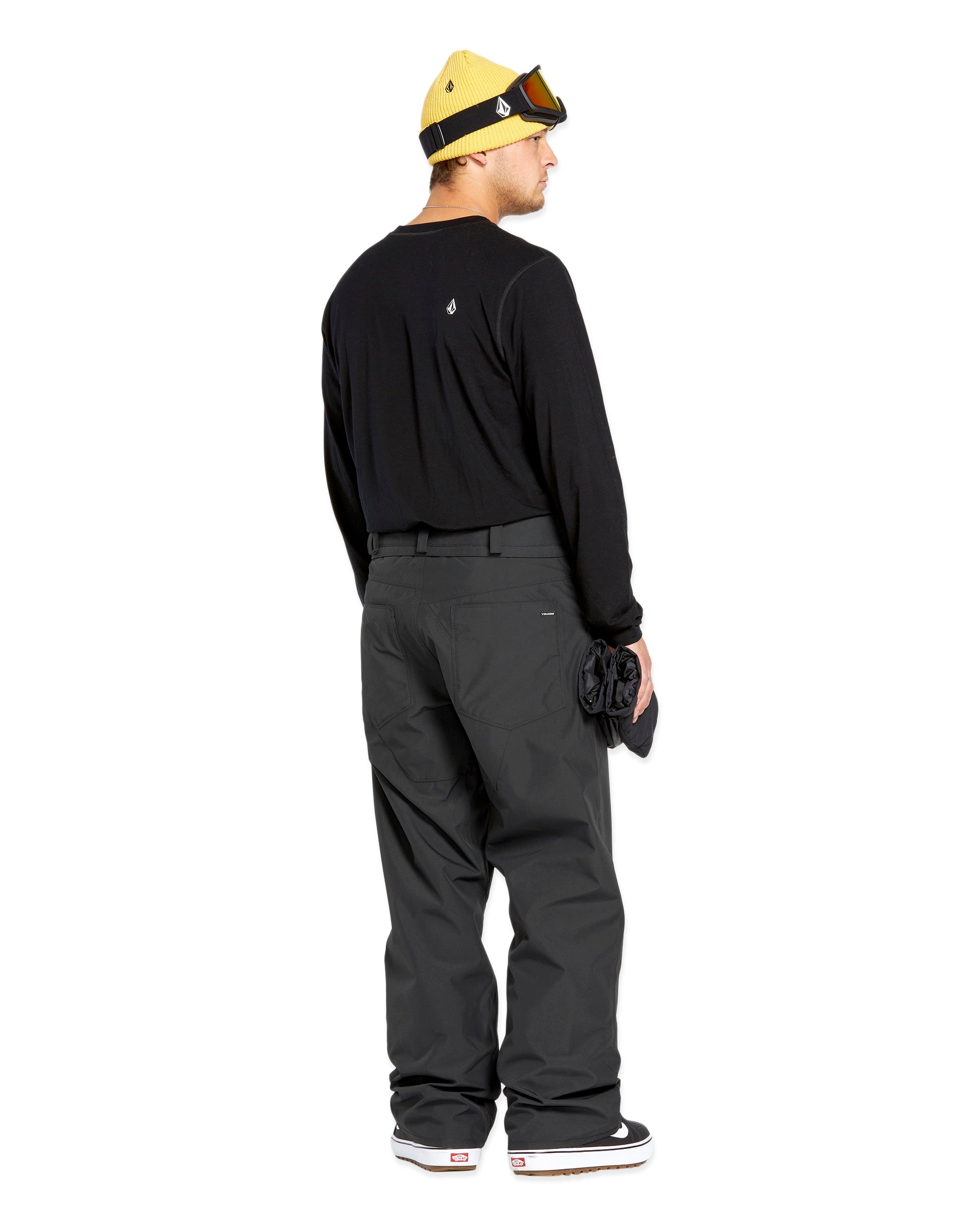 Volcom Men's 5 Pocket Shell Pant - Black pants with white logo on left thigh pocket.
