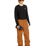 Volcom Men's 5 Pocket Shell Pant - A pair of khaki-colored snow pants with five pockets and a zippered fly.