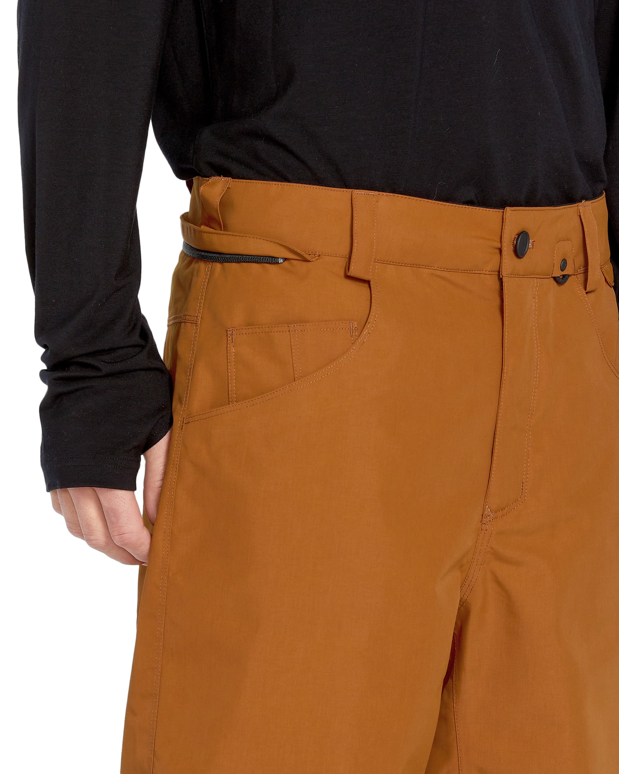 Volcom Men's 5 Pocket Shell Pant - A pair of khaki-colored snow pants with five pockets, including two zippered thigh pockets and three open cargo pockets.