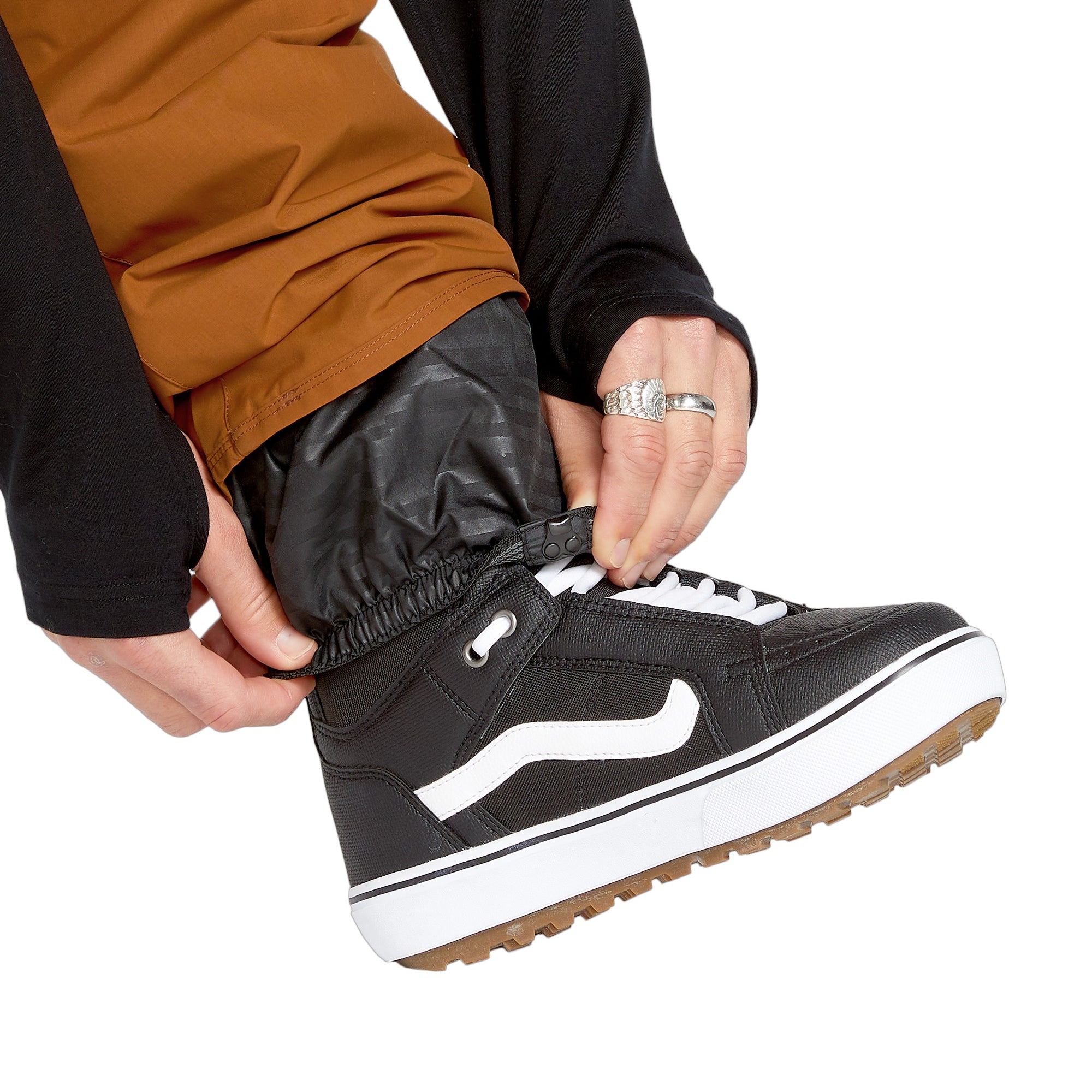 Volcom Men's 5-Pocket Shell Pant - A pair of black pants with five pockets, featuring a zippered fly and elastic waistband.