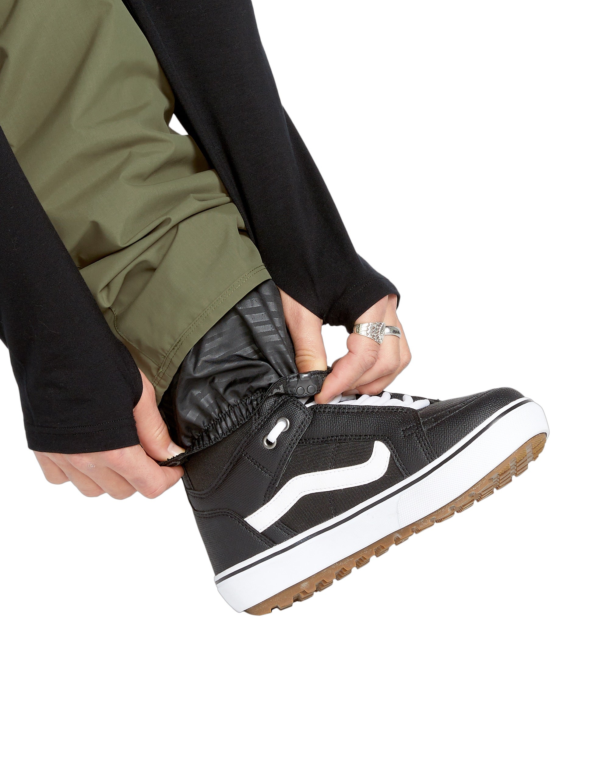 Volcom Men's 5-Pocket Shell Pant - A pair of olive green pants with five pockets, featuring a zip fly and elastic waistband.