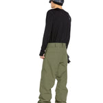 Volcom Men's 5 Pocket Shell Pant - Olive green pants with two zippered pockets on each side and a small pocket at the back.