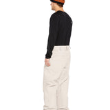 Volcom Men's 5 Pocket Shell Pant - Beige pants with a subtle sheen and two zippered pockets on each side.
