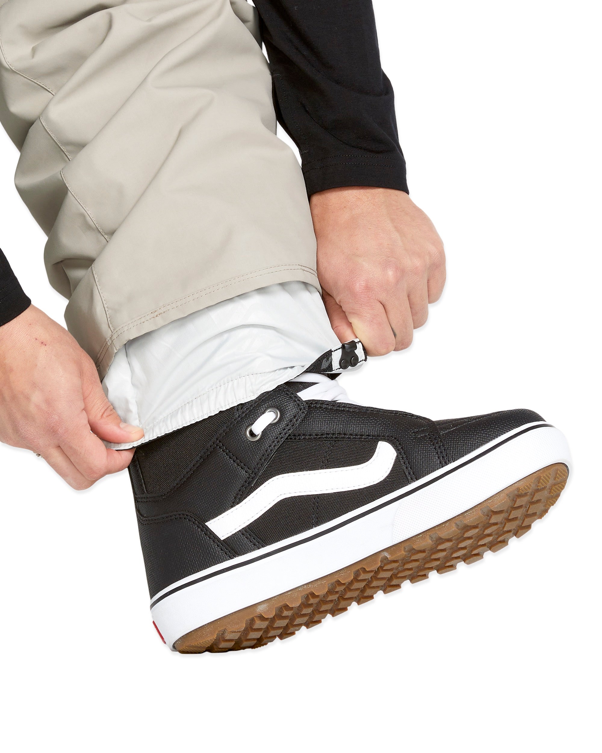 Volcom Men's 5 Pocket Shell Pant - Beige pants with multiple pockets and a zippered fly.