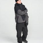 Black snowboard pants with tapered legs and reinforced ankle openings.