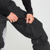 Black stretch ski pants with adjustable waistband and side pocket zipper detail