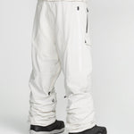 Off-white snowboard pants with belt loops, thigh pockets, and ankle zips.