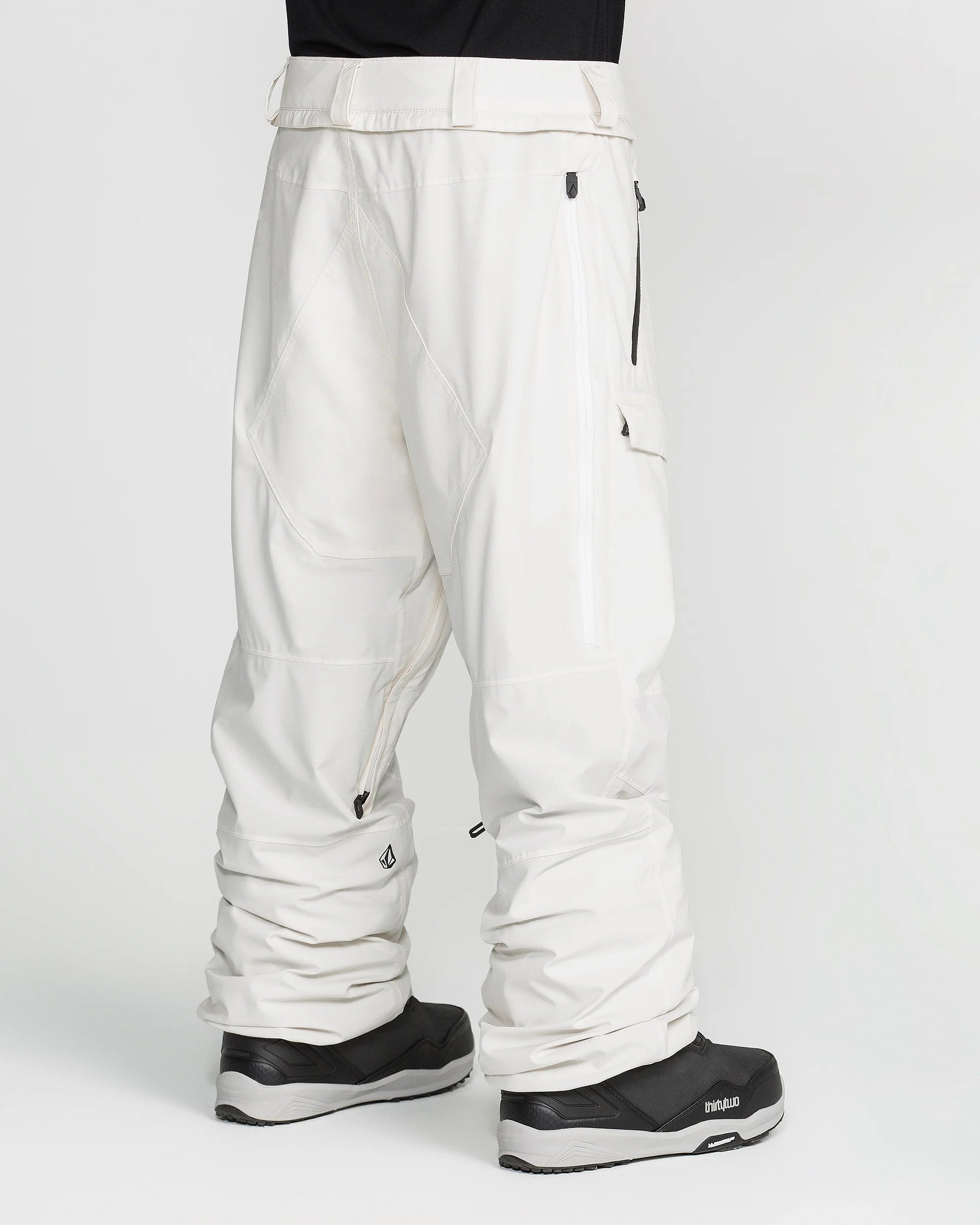 Off-white snowboard pants with belt loops, thigh pockets, and ankle zips.