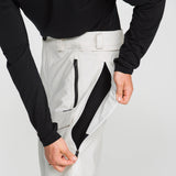 Off-white snowboard pants with front zip leg pocket and brushed interior lining.