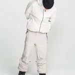 Off-white stretch snow pants with multiple cargo pockets, belt loops, and cuffed hems