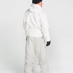 Off-white ski pants with belt loops, cargo pockets, and elastic boot-cuff hems