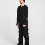 Black bib snow overall front view with chest pockets and side cargo pockets