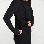 Black bib snow overall with front pockets, adjustable strap, and relaxed fit
