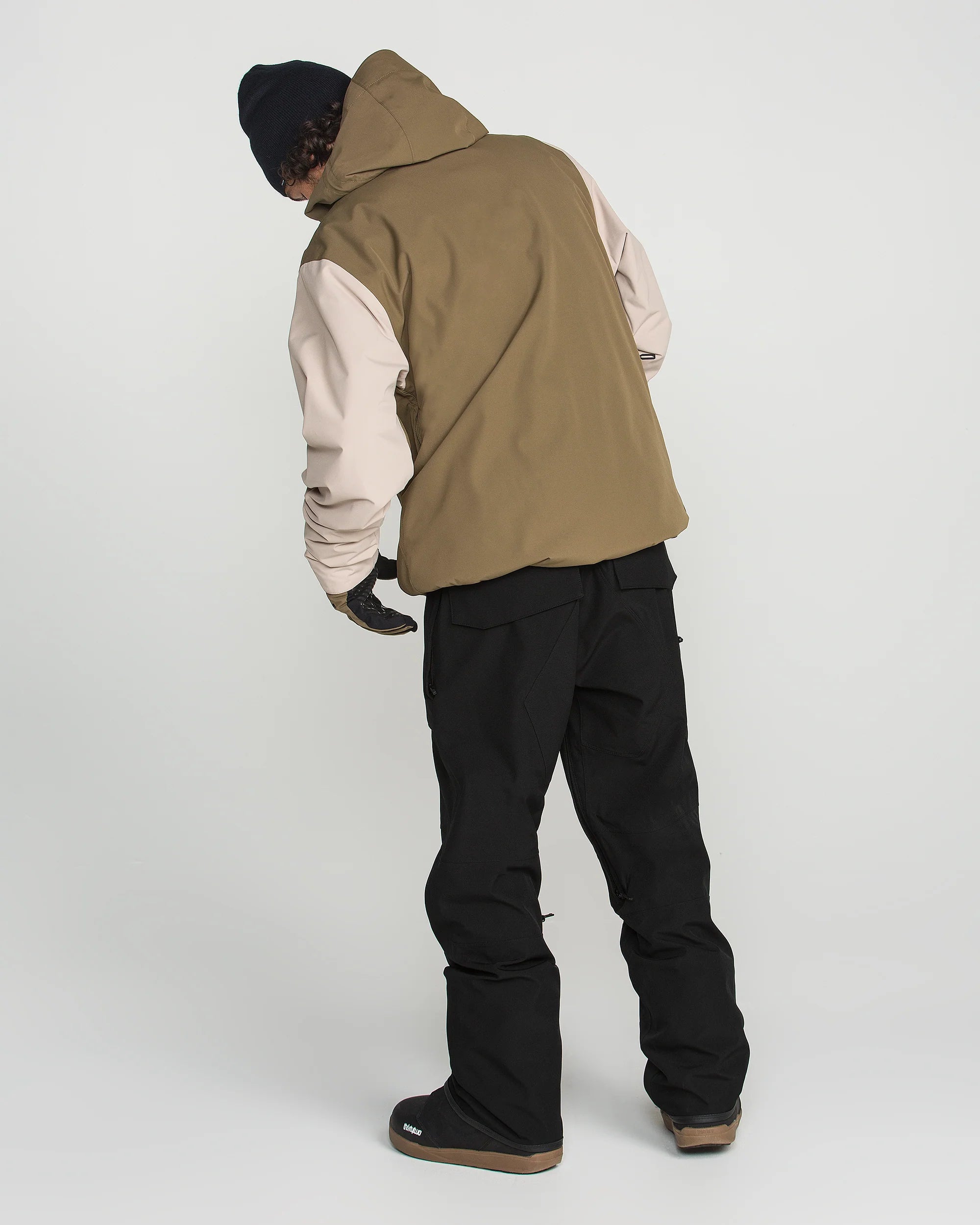 Teak and black bib snow overalls with adjustable straps and cargo pockets