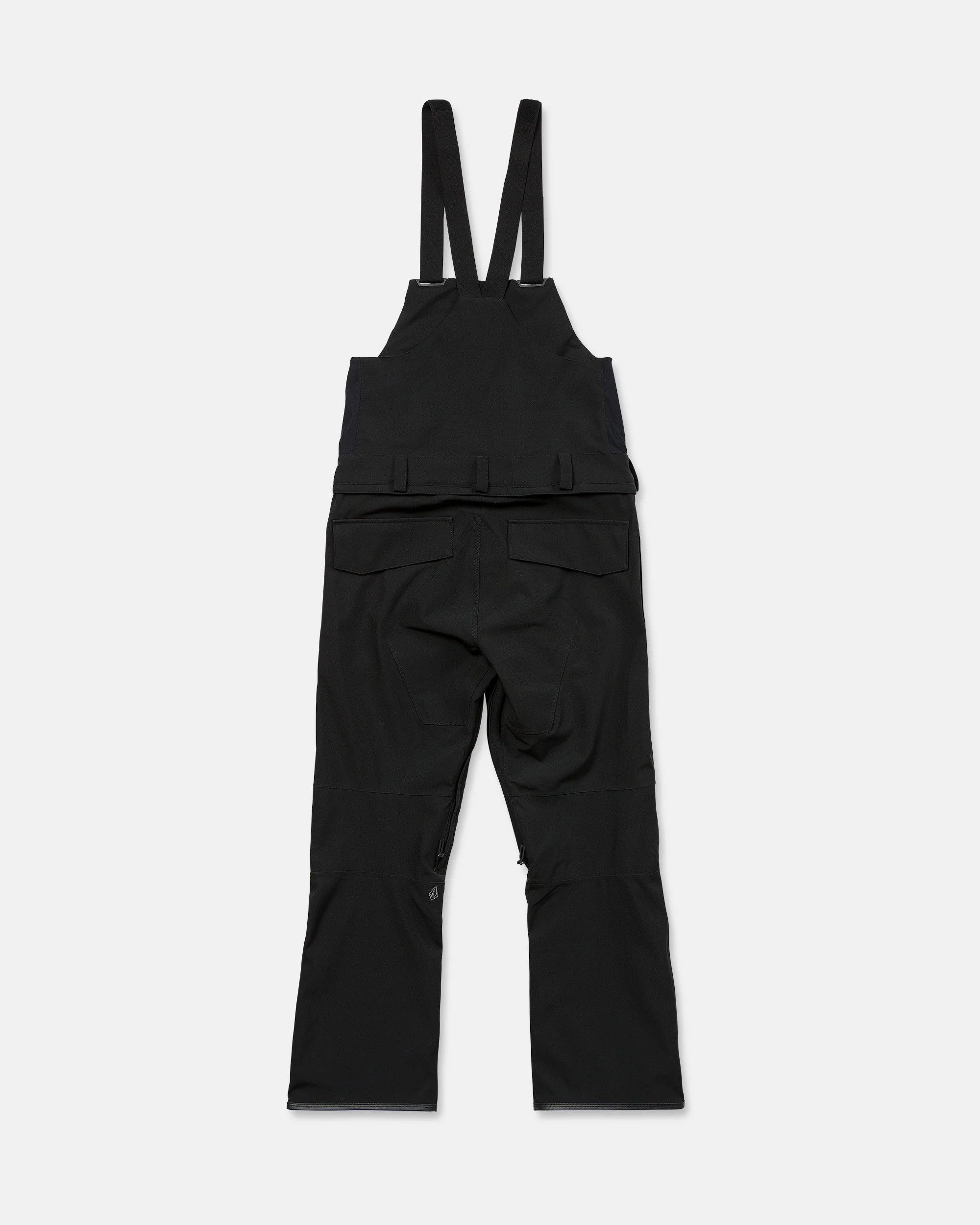Black bib snow overalls on white background with adjustable straps and cargo pockets