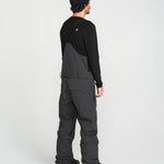 Black bib overall back view with shoulder straps and wide leg fit