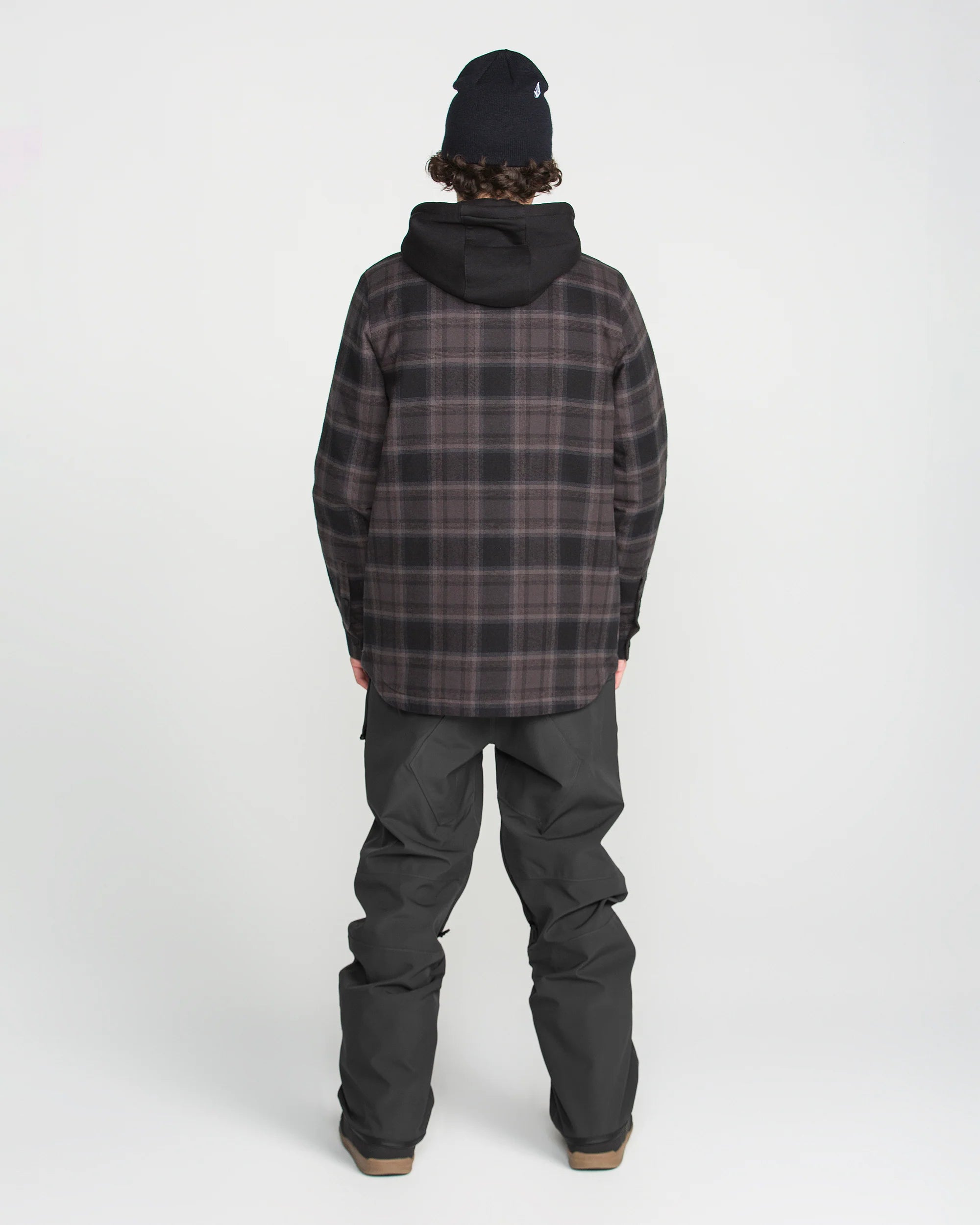 Black bib overall from back view with adjustable straps and roomy straight legs