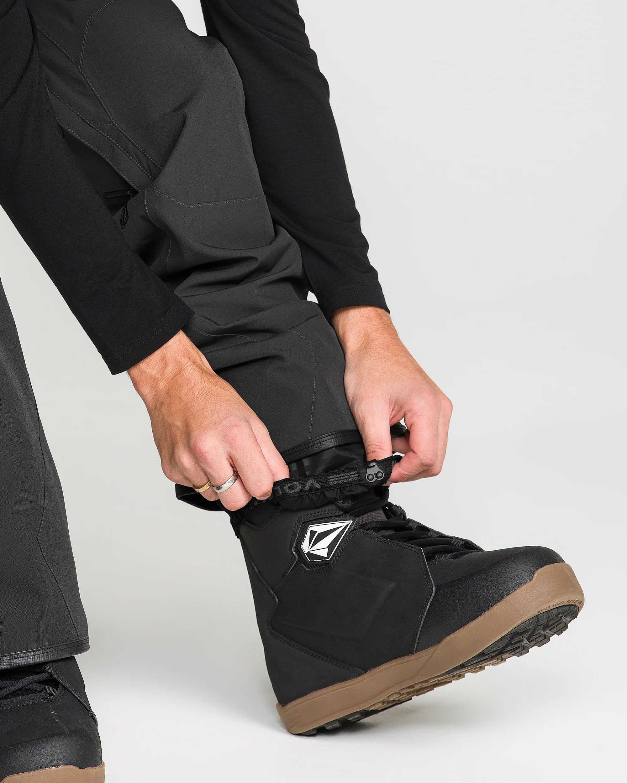 Black bib overall ankle cuffs and foot strap with rubberized logo patch