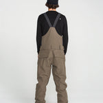 Brown bib overall back view with V-shaped strap panel and cargo pockets