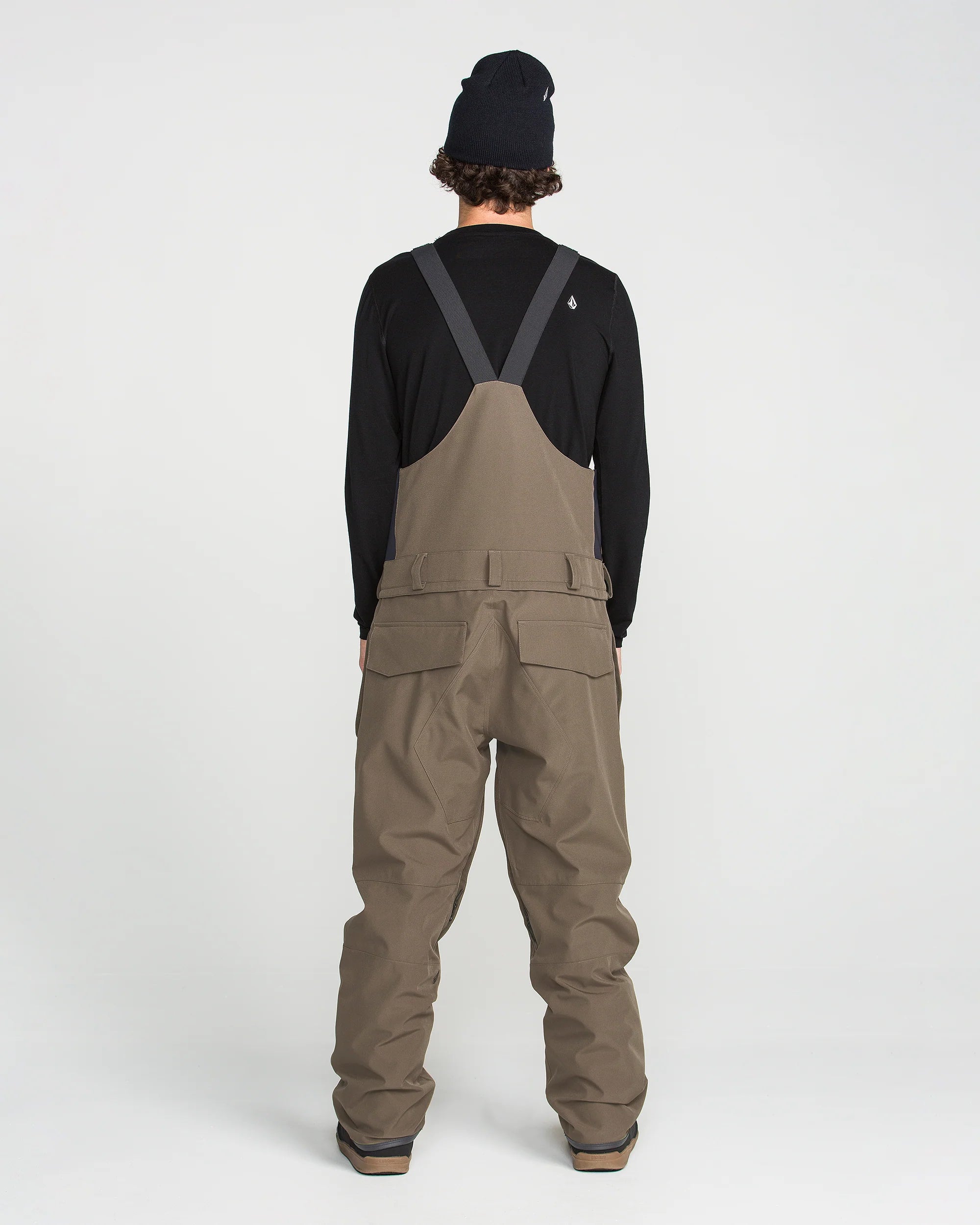 Brown bib overall back view with V-shaped strap panel and cargo pockets