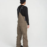 Brown bib overall back view with adjustable shoulder straps and cargo pockets