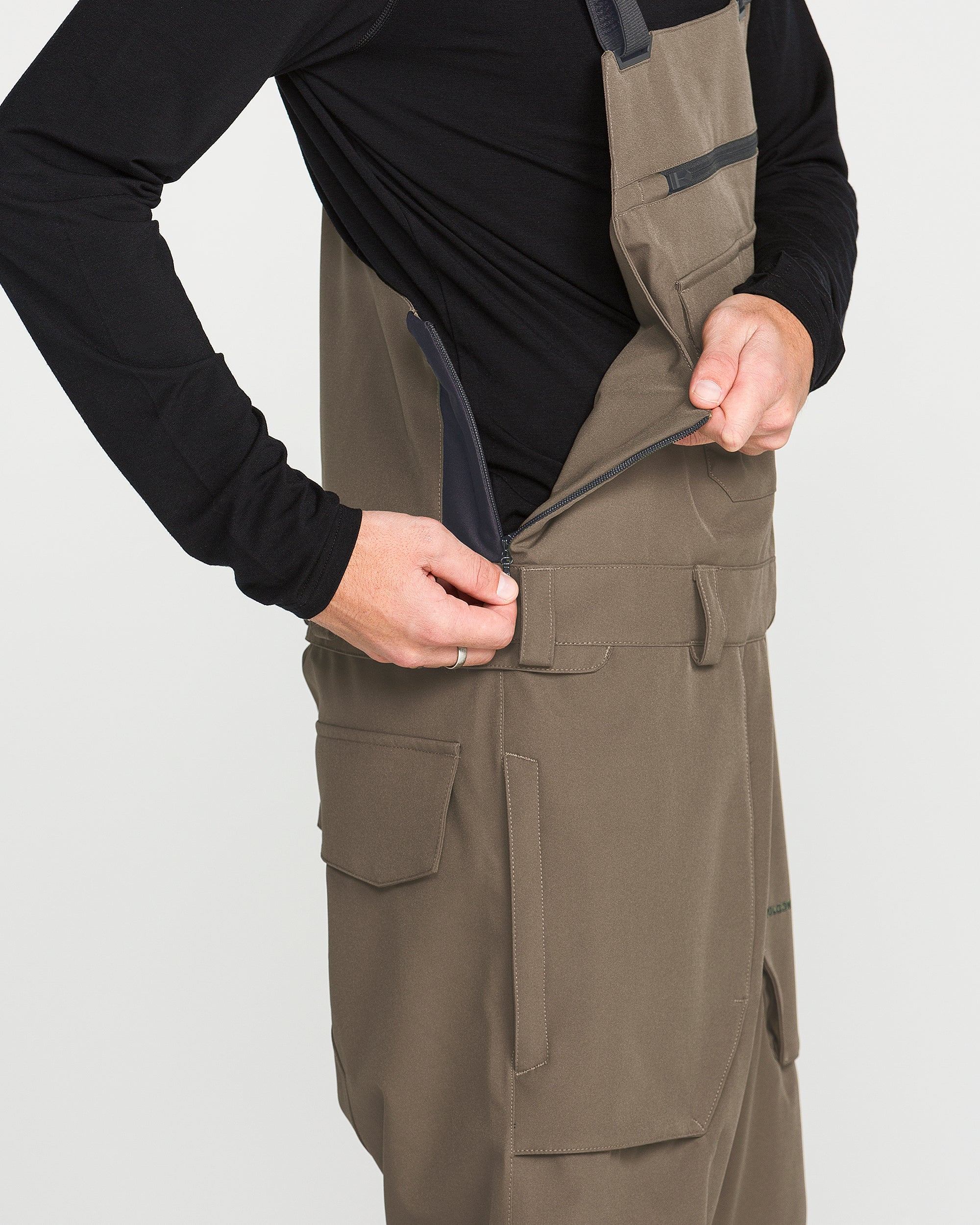 Teak bib overall with front cargo pockets and zipper side opening