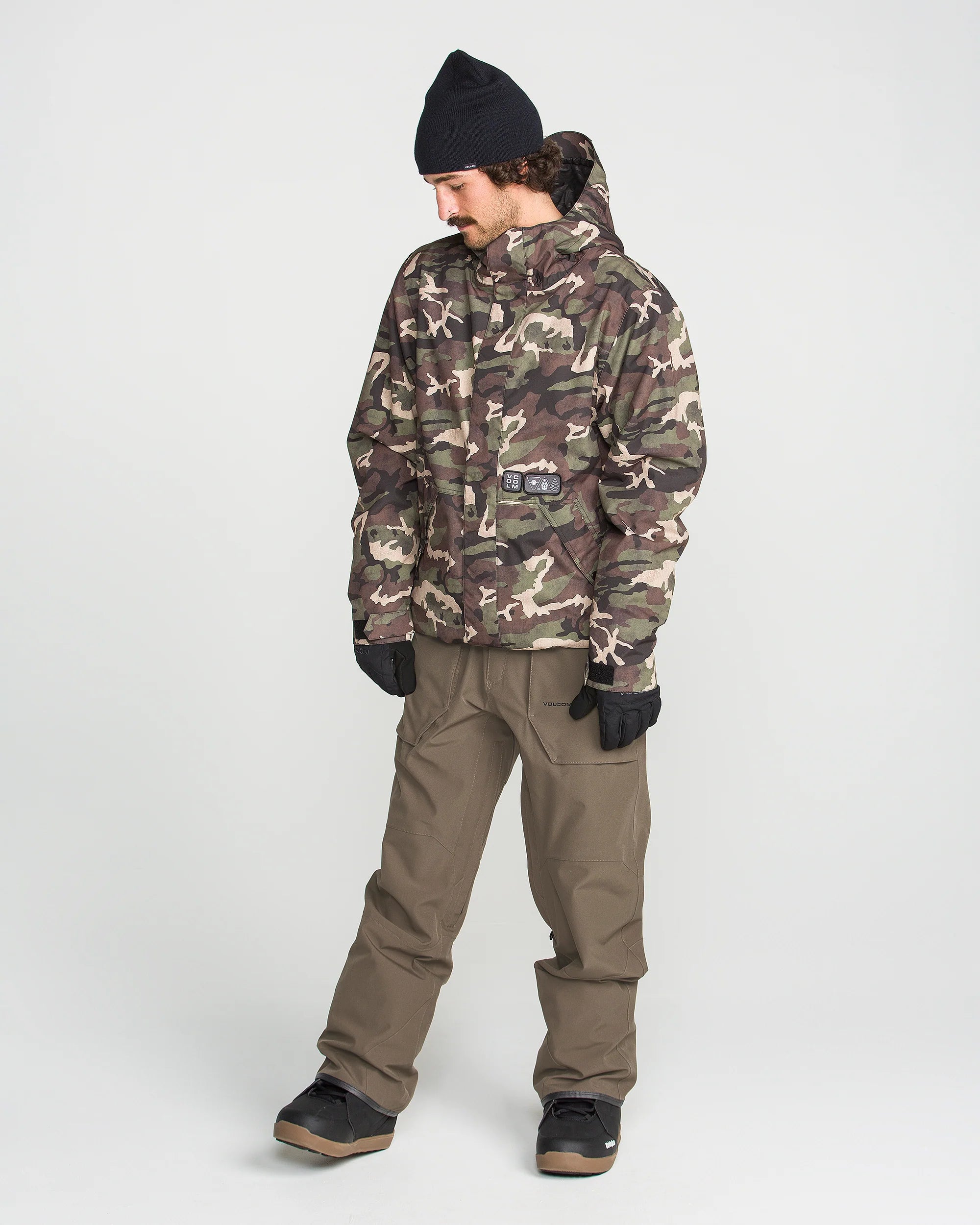 Brown bib overall worn at angle with front bib panel and utility cargo pockets