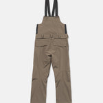 Brown bib overall with black adjustable shoulder straps and multiple cargo pockets