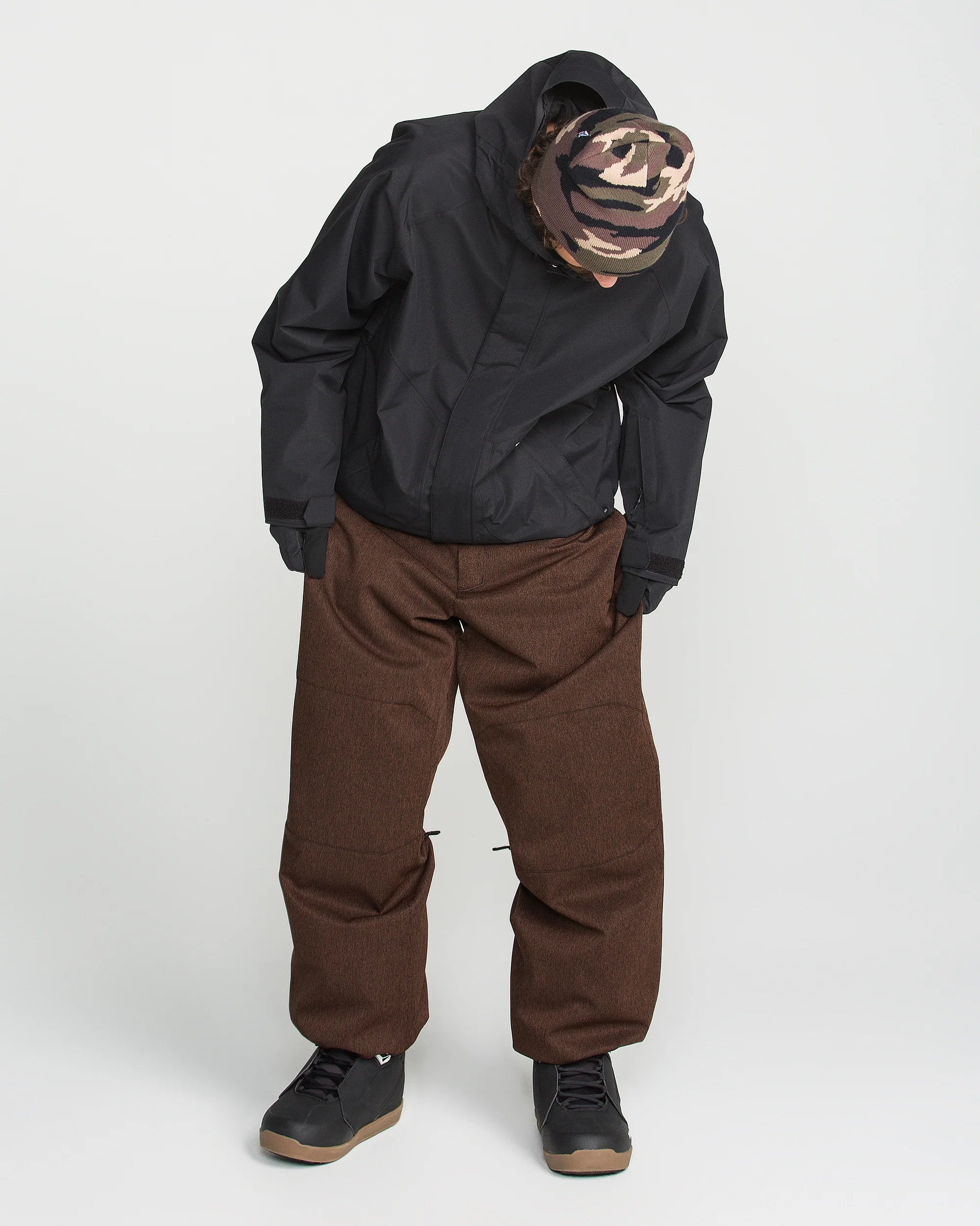 Brown snow pants with two front pockets and relaxed straight legs