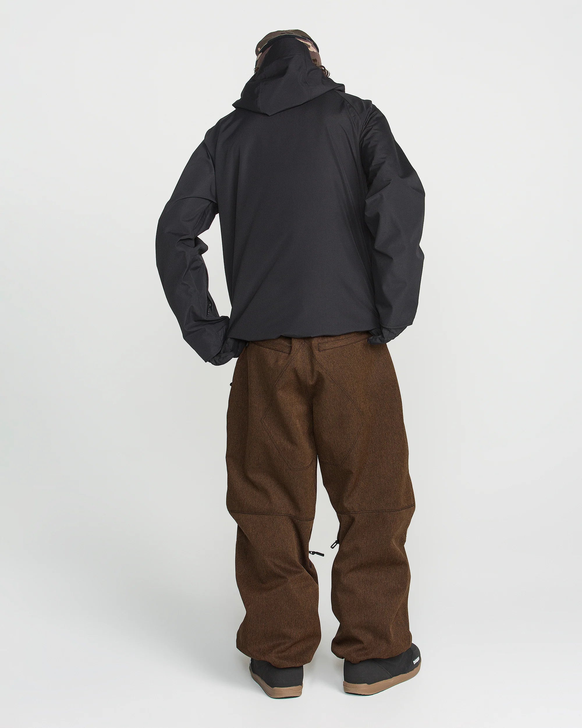 Brown and black snow outfit pants with relaxed fit and cuffed hems