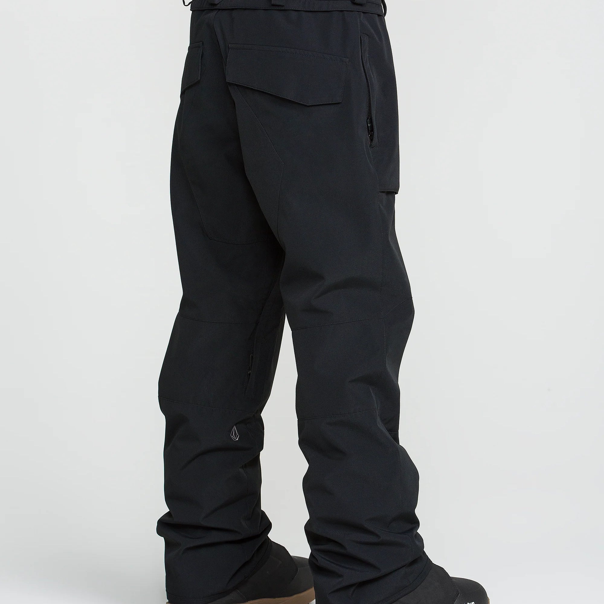 Black snowboard pants with back flap pockets and adjustable waistband belt