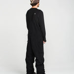 Black bib overall in back view with full-length legs and ankle cuffs