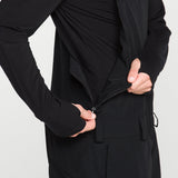 Black bib overall front view with zip pocket, adjustable waist tie, and cargo pockets