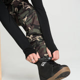 Camo bib overalls leg cuffs with black side panel and tan outsole boots