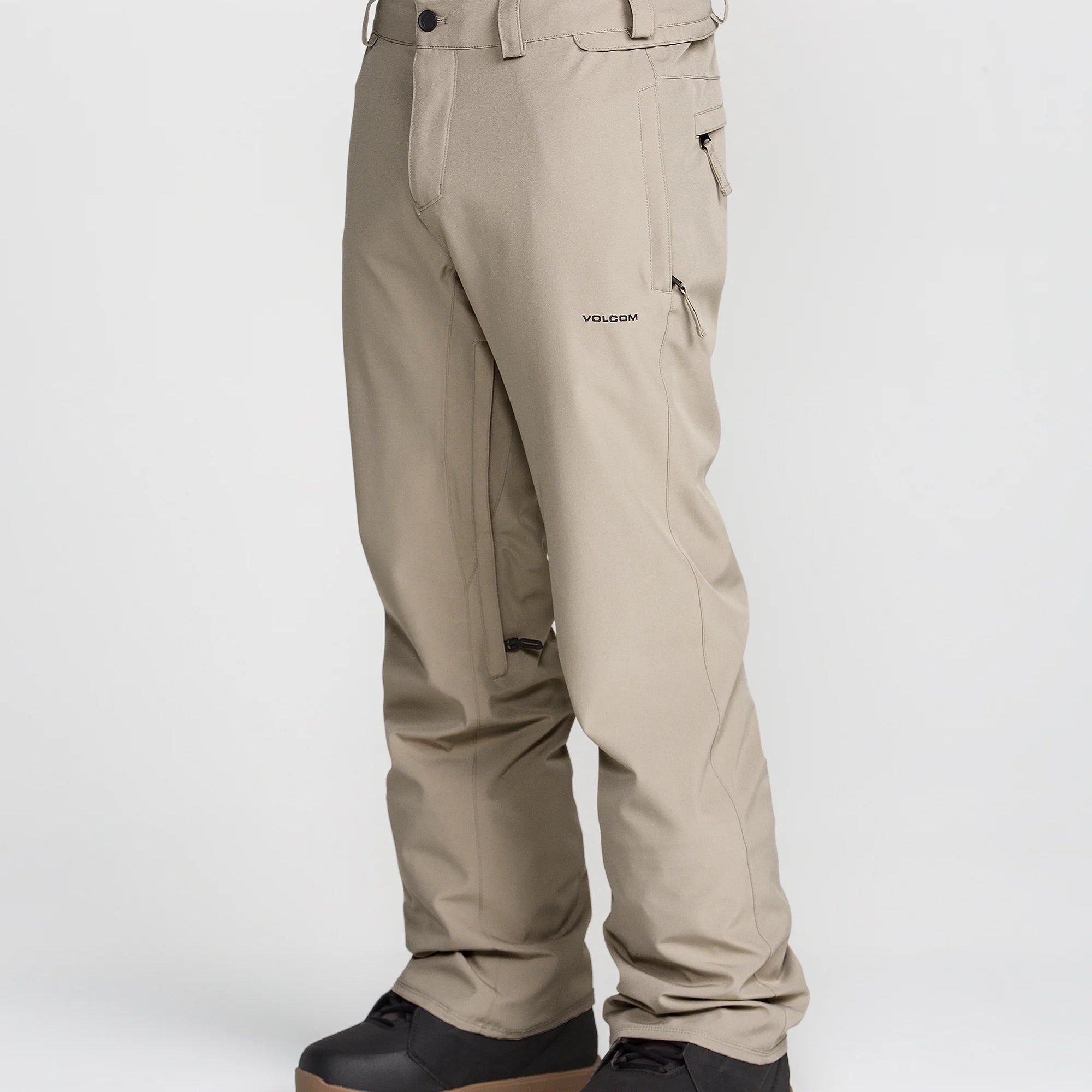 Tan snow chino pants with zip ankle cuffs and side pocket openings