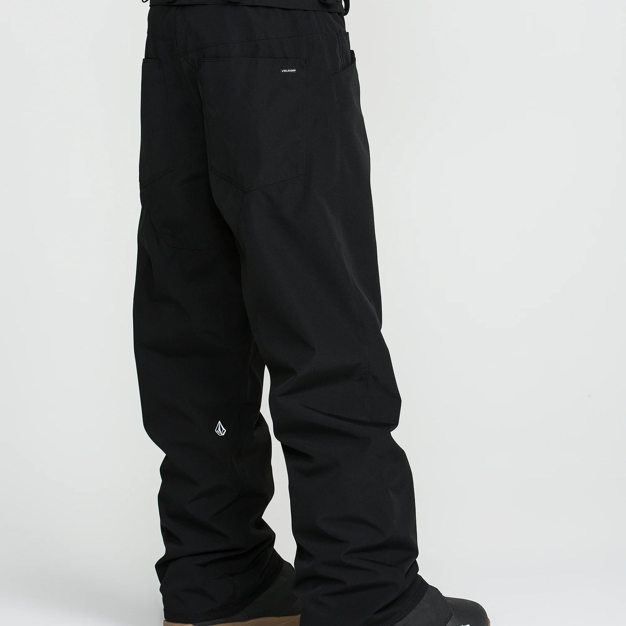 Black snow pants with cargo-style pockets and cuff straps